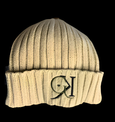 Beige GK beanie on a black background