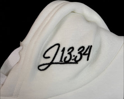 Close-up of the J13:34 embroidery on the hood