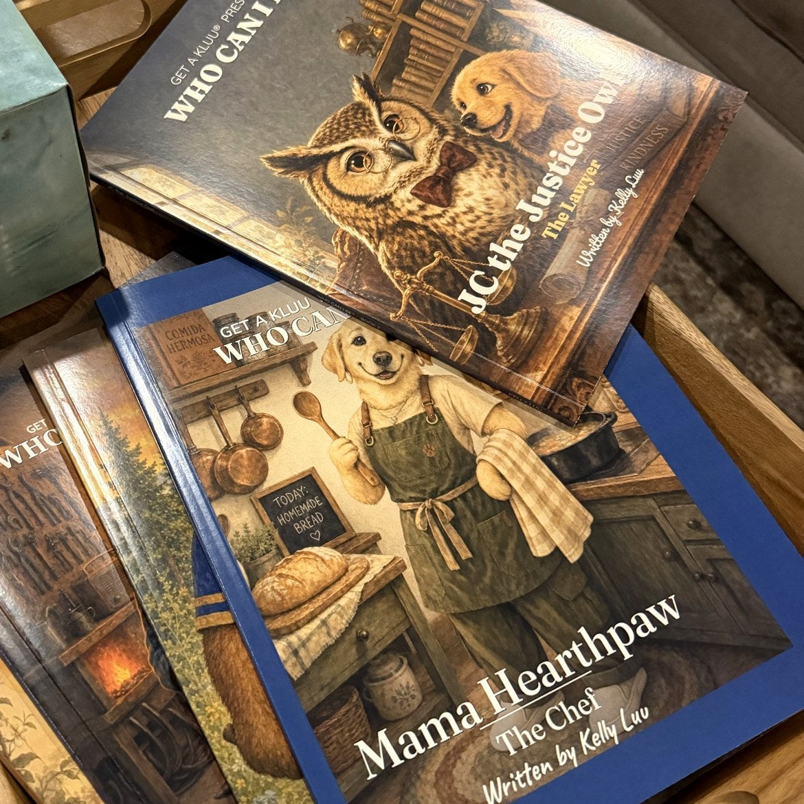 Who Can I Be? books, including JC the Justice Owl and Mama Hearthpaw, at home