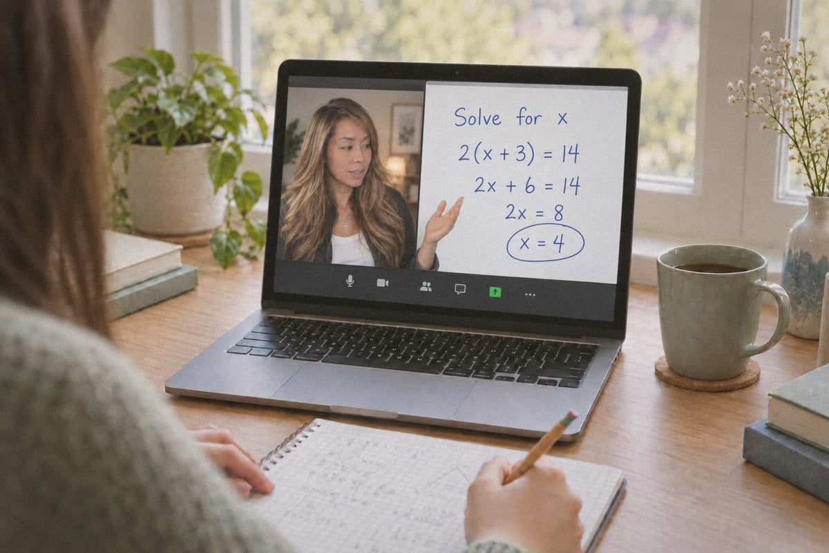 Kelly Luu explains a math problem to a student over a video call while the student takes notes